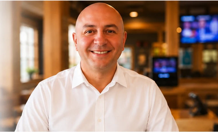 Julio Gallardo smiling in a white shirt